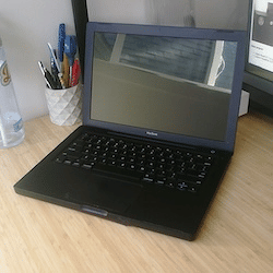 A black MacBook laptop