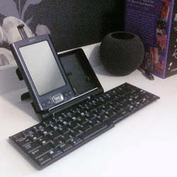 A Palm TX PDA sitting in a Palm folding keyboard