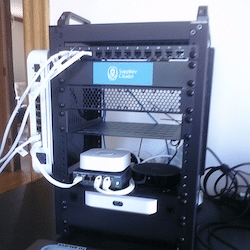 A black 8U, 10 in. rack with network equiptment