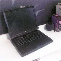 A black PowerBook laptop
