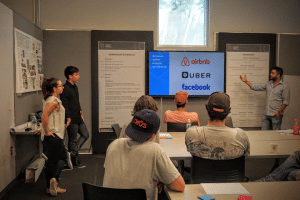 The team presenting an early prototype of the workshop